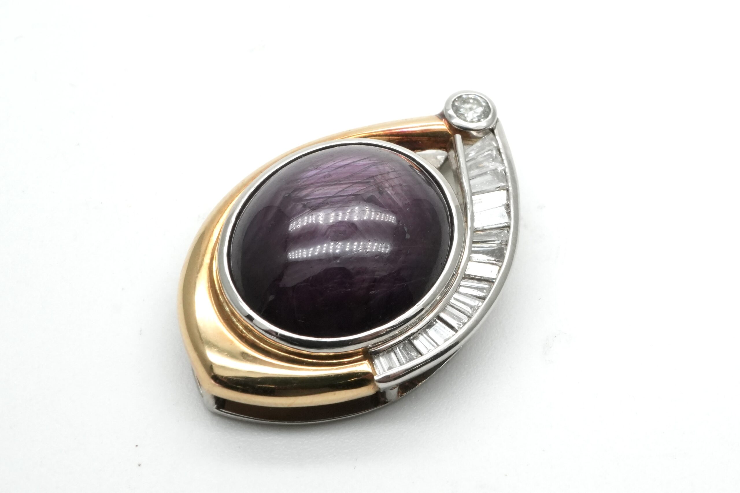 投稿記事「パープルスターサファイヤダイヤペンダント 750/900 19.44ct 0.55ct を買取しました！」の商品画像