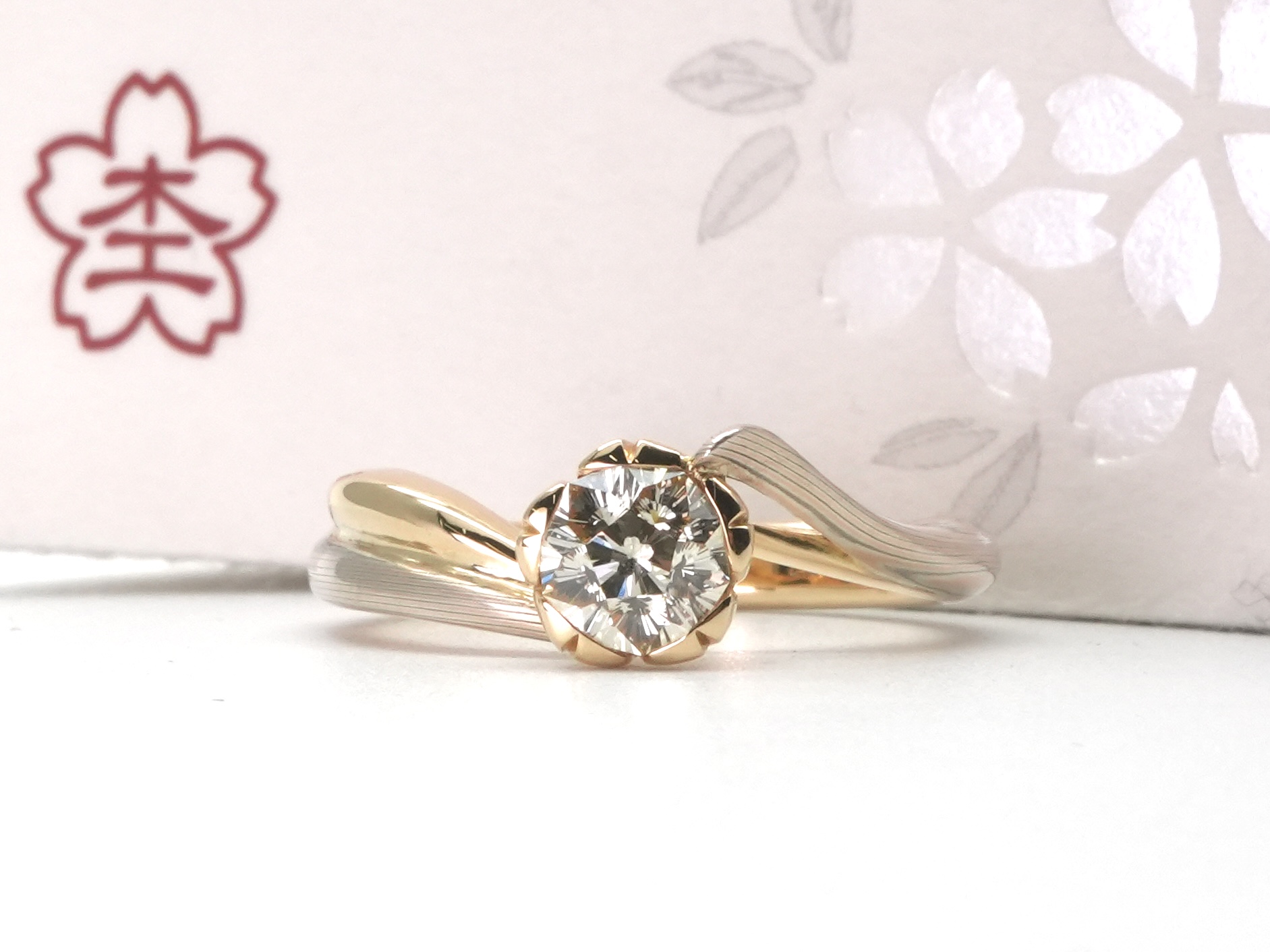 投稿記事「杢目金屋 さくら ダイヤモンド エンゲージリング K18YG SV 0.528ctを買取しました！」の商品画像
